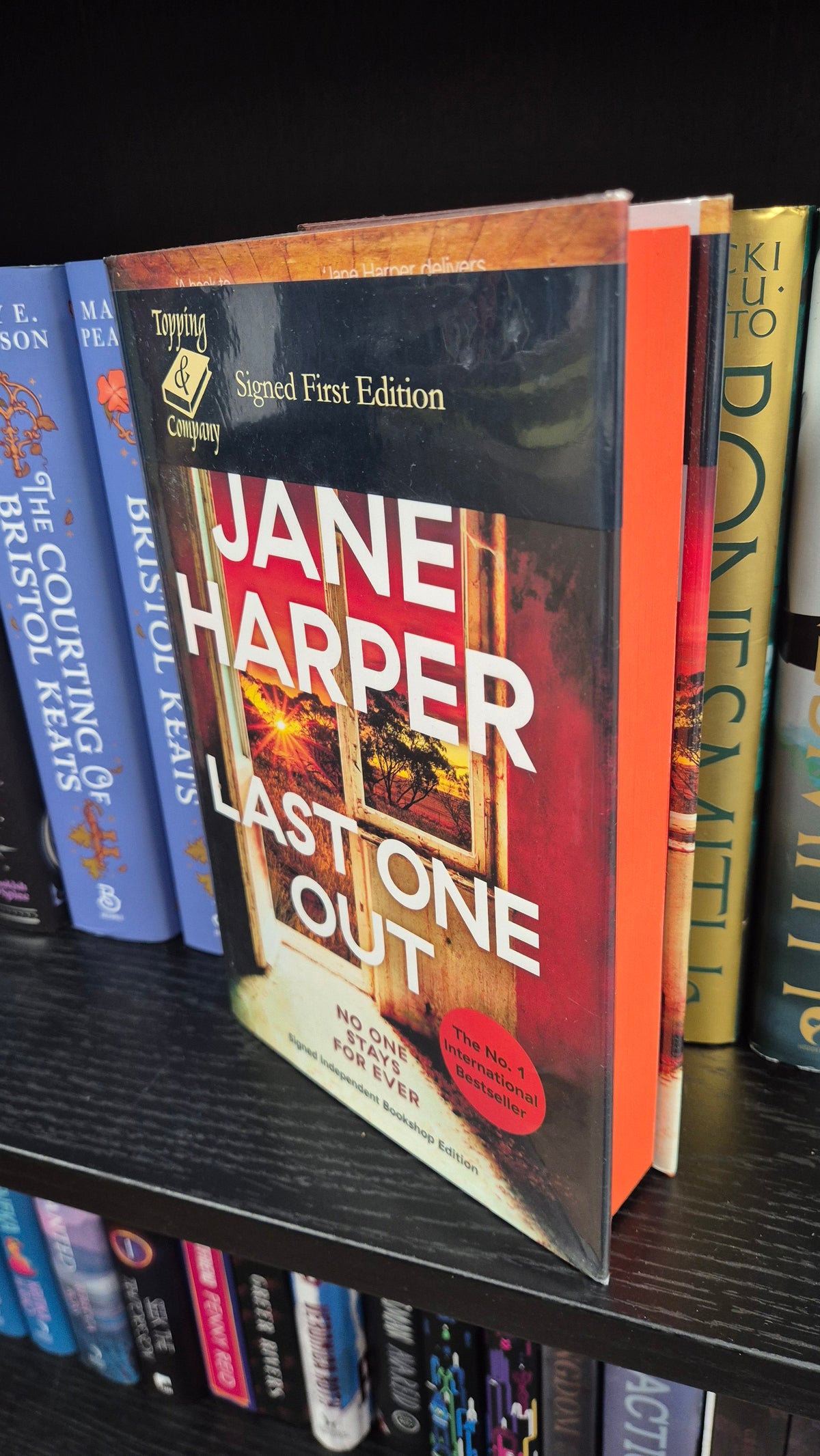 Last One Out by Jane Harper | Signed First Edition | Topping & Company Exclusive | Orange Sprayed Edges