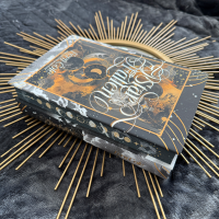 Starfallen special-edition hardback displayed on a gold sunburst tray